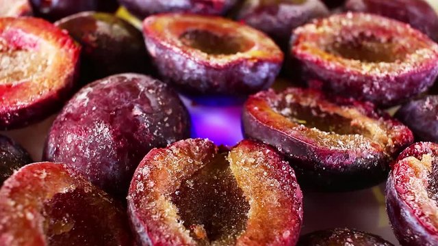 Frosen plum plums purple half fruit rotating texture pattern closeup footage