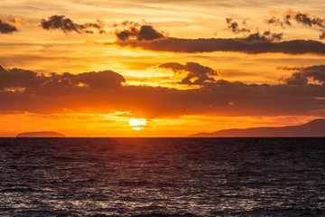 Sunrise or sunset over sea surface