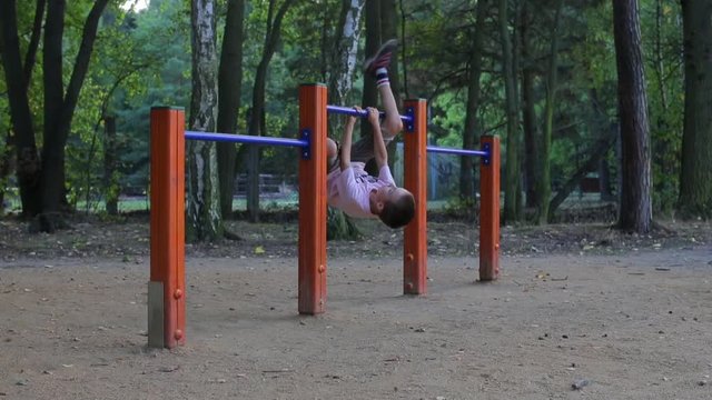 Boy hanging upside down