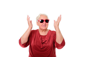 Portrait of Happy senior woman 75-80 years old with red eyeglasses on white isolated background
