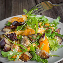 Healthy salad of vegetables - tomatoes, arugula, eggplant