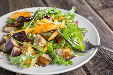 Healthy salad of vegetables - tomatoes, arugula, eggplant
