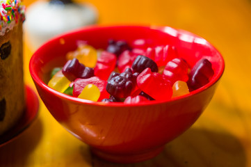 translucent multi-colored jelly sweeties in red bowl