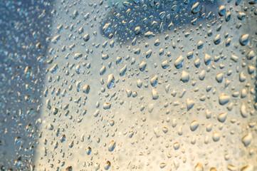 background of raindrops on window glass, close up