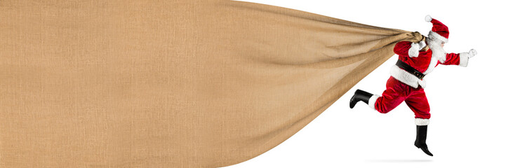 late Santa claus in a hurry with traditional red white costume and big gift bag with copy space running jumping abstract funny christmas xmas background