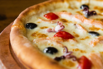 delicious pizza with meat, cheese and mushrooms	