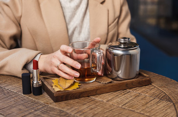 Cup of hot tea and red lipstick. Break