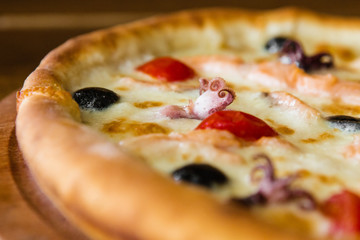 delicious pizza with meat, cheese and mushrooms	