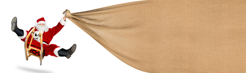 crazy santa claus on his sleigh big gift bag with copy space hilarious fast funny crazy xmas christmas present delivery isolated white background