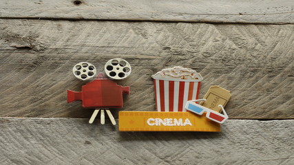 tub of popcorn with cinema sign and 3d glasses and movie projector