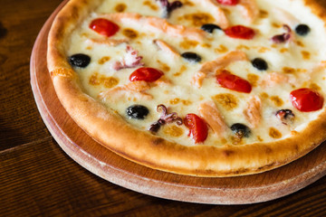 delicious pizza with meat, cheese and mushrooms	