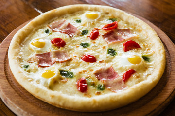 delicious pizza with meat, cheese and mushrooms	