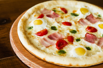 delicious pizza with meat, cheese and mushrooms	