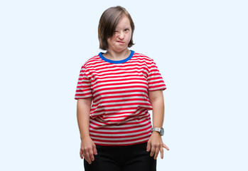 Young adult woman with down syndrome over isolated background winking looking at the camera with sexy expression, cheerful and happy face.