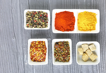 Set of Various spices on black stone table. Top view