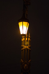 Fototapeta na wymiar old style lighted street lantern