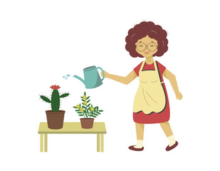 Woman watering flowers from a watering can. Female takes care of domestic plants. Happy lady grows flowers, cactus.