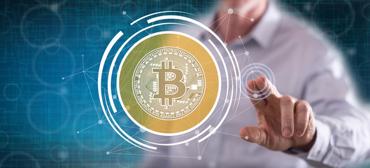 Man touching a bitcoin currency concept