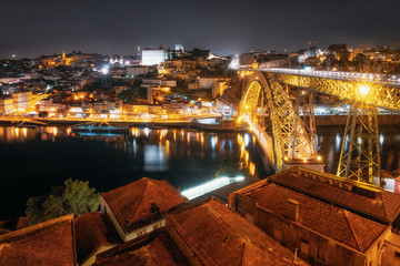 Porto cityscape over the Douro River and Dom Louis I Bridge at night, Portugal