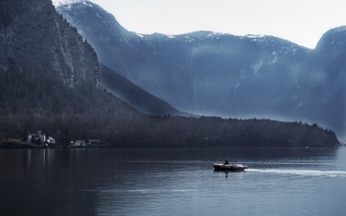 lake in the mountains and boat