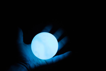 alight divination ball in arm