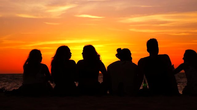 People rest on the sand beach