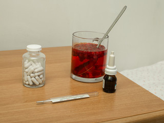 medical set on the nightstand with cranberry mors © Valeriy