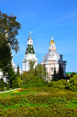Fototapeta na wymiar The Church of the Smolensk Icon of the Mother of God Hodigitria (1746 - 1753) is located behind the bell tower, opposite the church of the Monks Zosima and Savvatii Solovetsky. Russia, Sergiev Posad, 