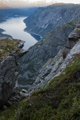 view of fjord through mountain ridge norway