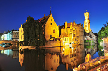Fototapeta na wymiar View of canal belfry and houses at Bruges Belgium.