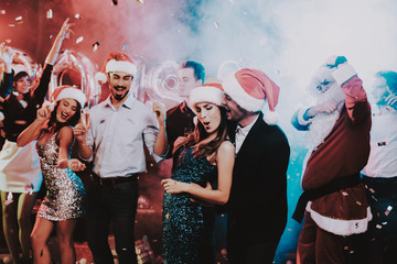 Obraz premium Happy Young People Dancing on New Year Party.