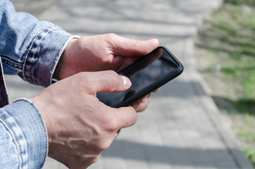 men's hands hold the phone