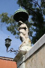 Fototapeta na wymiar Venice, statue with canopy and lamp post