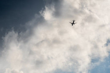 The plane flies in the clouds