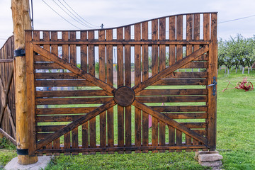 Naklejka premium Old wooden village gate 