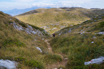 Fototapeta na wymiar Young man hiking a trail in Galicica National Park.