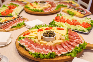 Mediterranean food with domestic olives, prosciutto and cheese