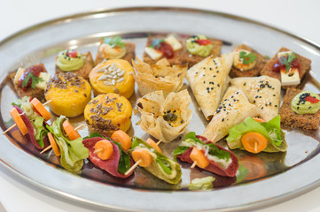 Catering banquet table with colorful food snacks 
