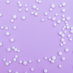 Frame of white shiny little balls looks like snow.  Winter holidays concept