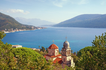 Fototapeta na wymiar Beautiful autumn Mediterranean landscape. Montenegro, Adriatic Sea. View of Savina Monastery and Bay of Kotor near Herceg Novi city