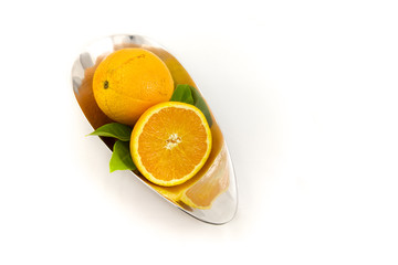 Oranges in a silver bowl