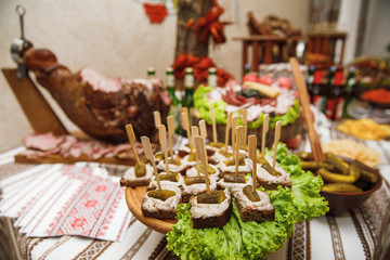 Catering banquet table with different food snacks and appetizers
