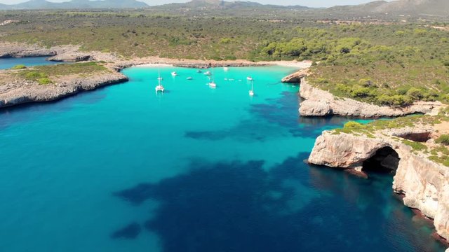 Aerial footage on Cala Varques beach, Mallorca. A hidden paradise with crystal clear water.