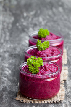 Beetroot Puree In Glass Jars On Wooden Table