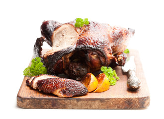Roasted duck with orange sauce isolated on white