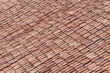 Beautilful old red tiles on a roof in Italy