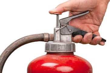 Holding a fire extinguisher