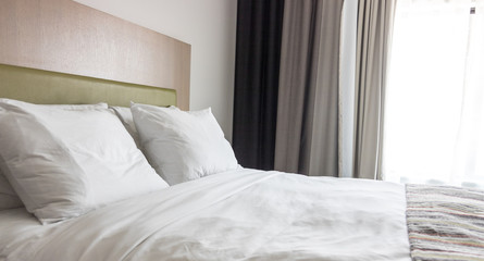Fototapeta na wymiar Elegant hotel bedroom, copy space image