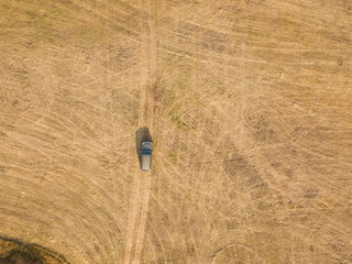 aerial top view of car isolated on summer field texture background f