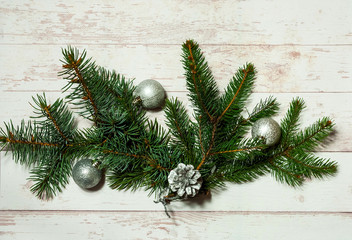 Christmas decor. Festive light background with fir branches and cones, top view, the concept of the New Year holidays, close up, copy space